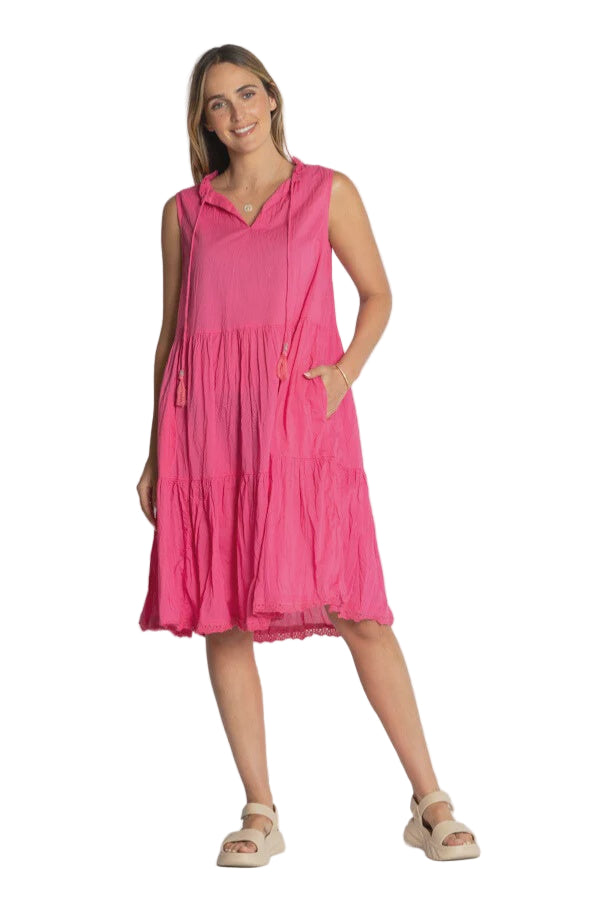 Woman wearing a pink dress against a white background