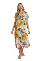 Woman wearing a colorful floral dress on a white background